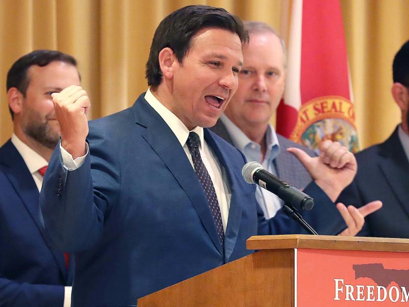 Florida Gov. Ron DeSantis gestures at a podium