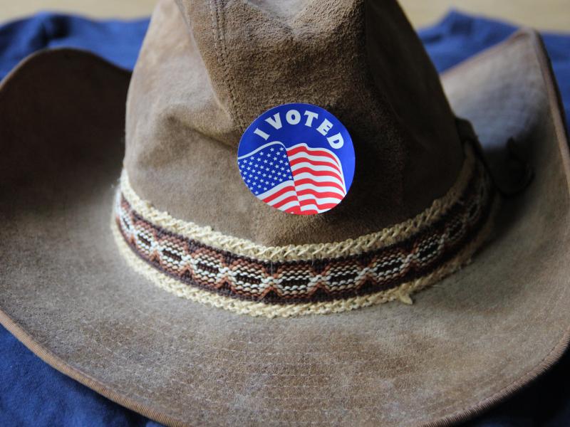 A cowboy hat with an "I voted" sticker