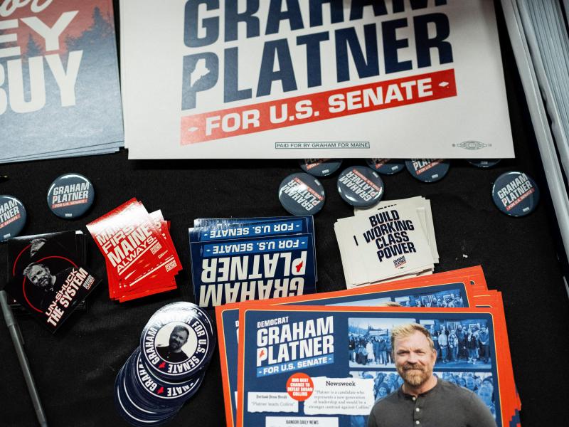 Signage and buttons for Graham Platner's campaign in Maine