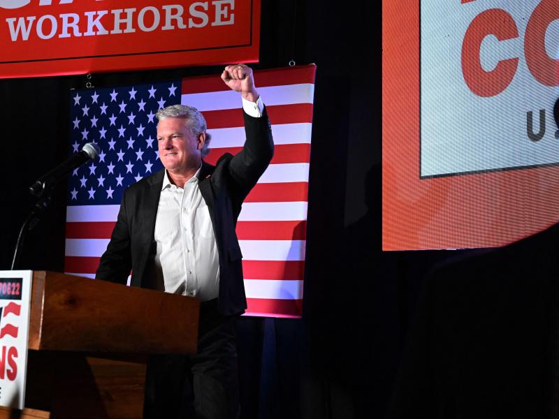Rep. Mike Collins pumps his fist at a campaign rally